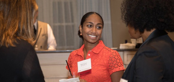 Image of Dr. Monica Soni talking with two other people at an event