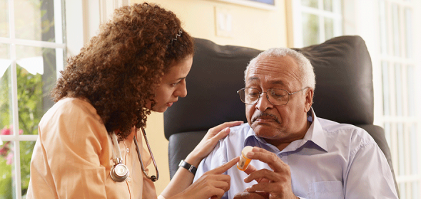 Community health worker interacts with patient