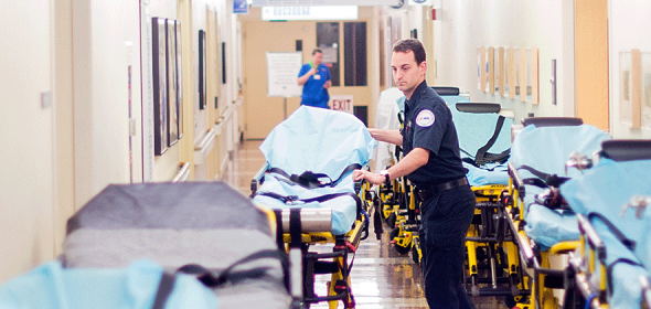 Community paramedic prepares for a patient 