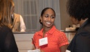 Image of Dr. Monica Soni talking with two other people at an event
