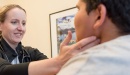 A physician works with a  patient
